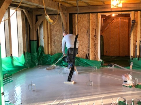Int. 2 Dec spreading the screed.jpg